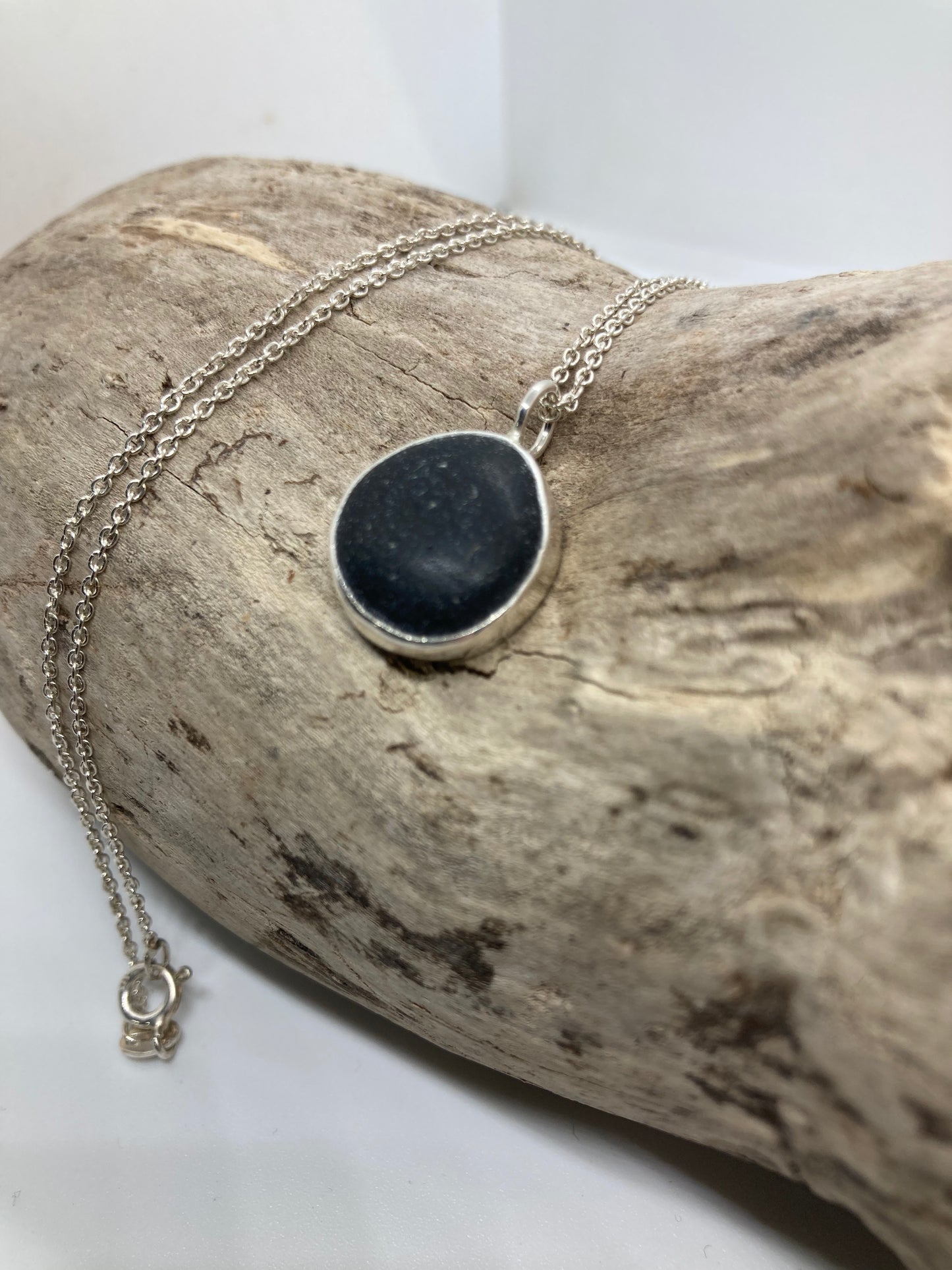 Black Seaham sea glass and sterling silver pendant