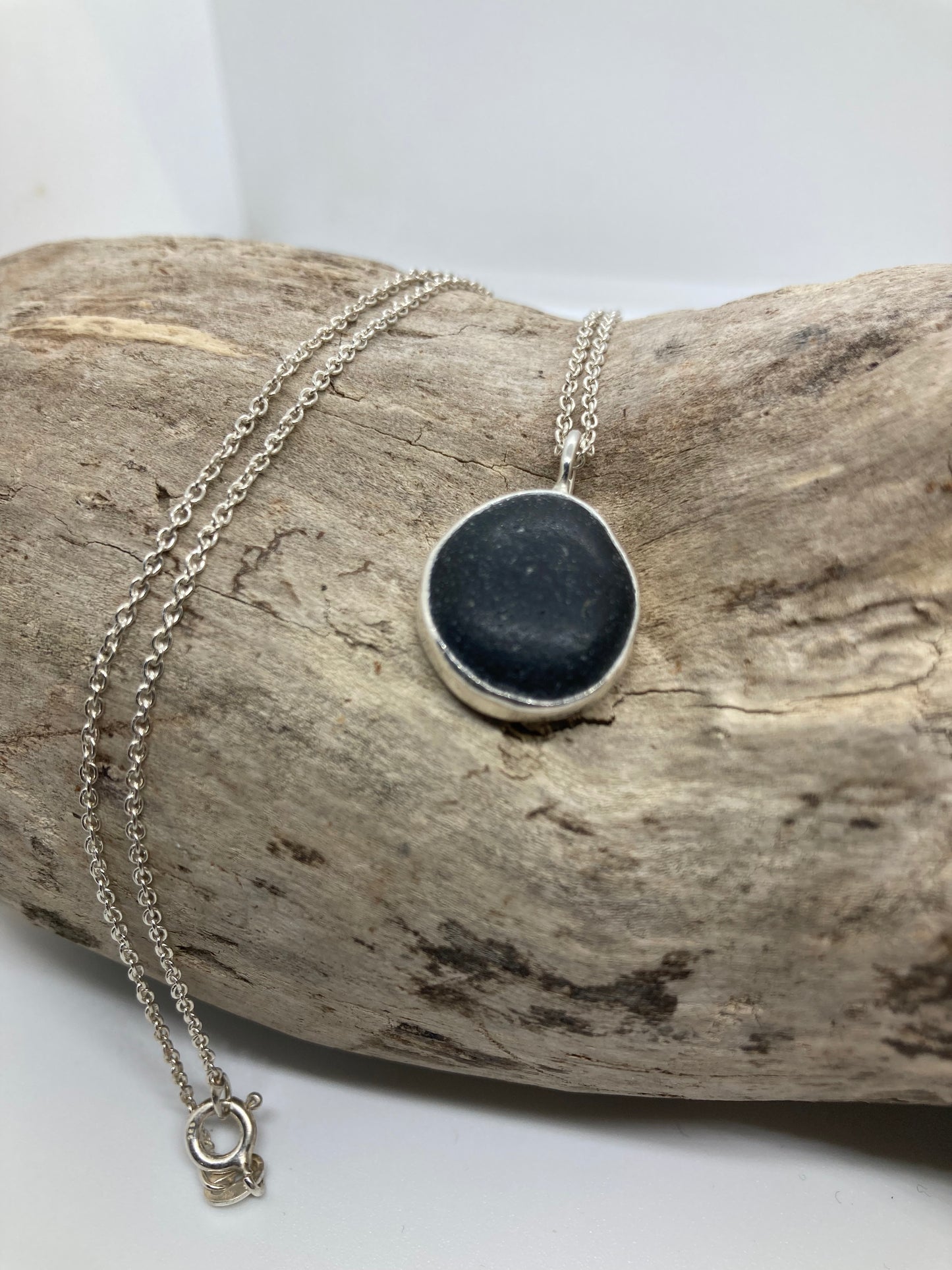 Black Seaham sea glass and sterling silver pendant