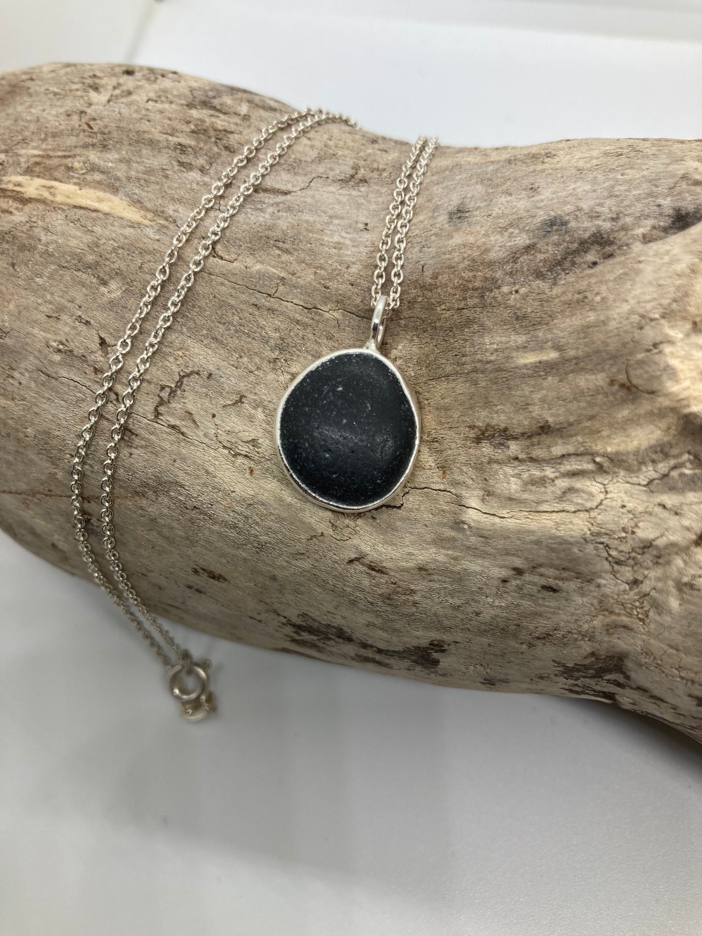 Black Seaham sea glass and sterling silver pendant