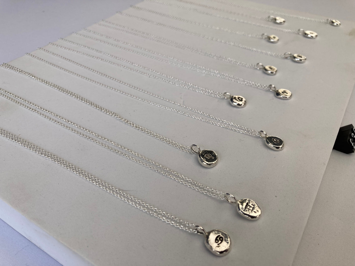 Star sign silver pebble pendants