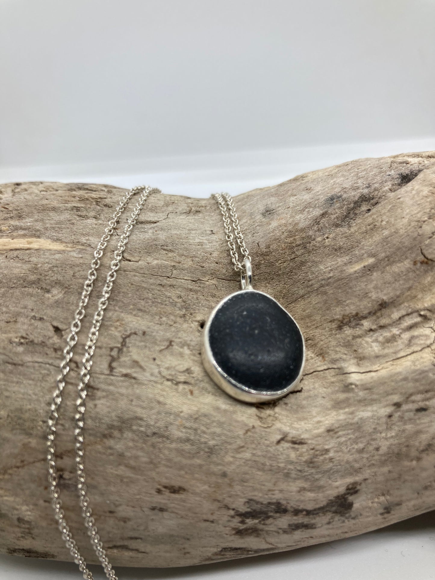 Black Seaham sea glass and sterling silver pendant