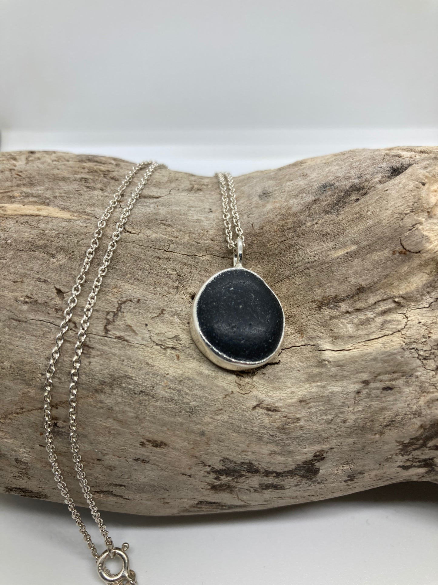 Black Seaham sea glass and sterling silver pendant