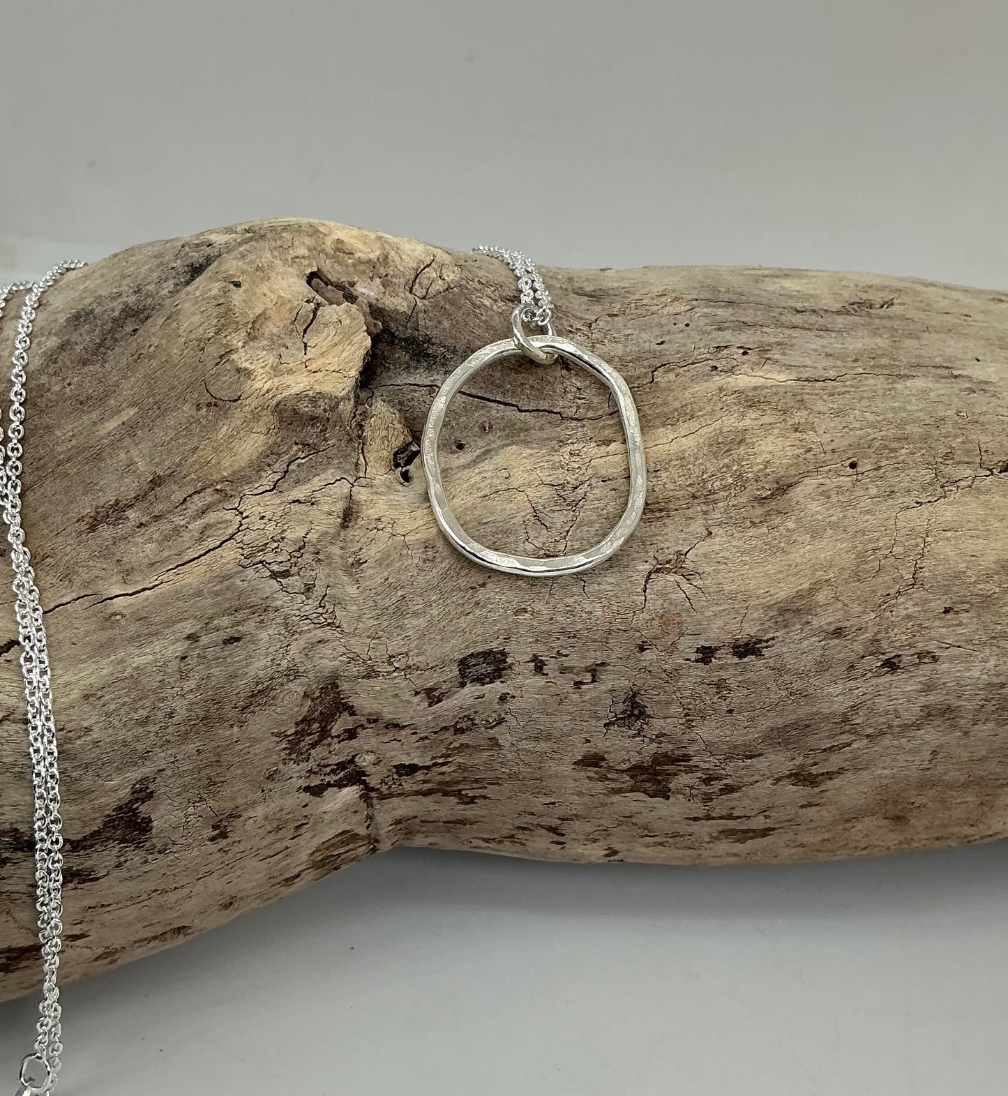 Hammered oval pendant