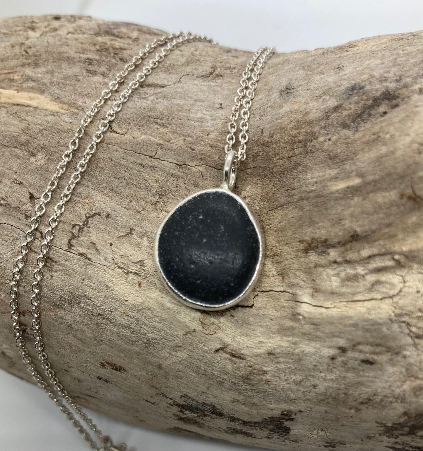Black Seaham sea glass and sterling silver pendant