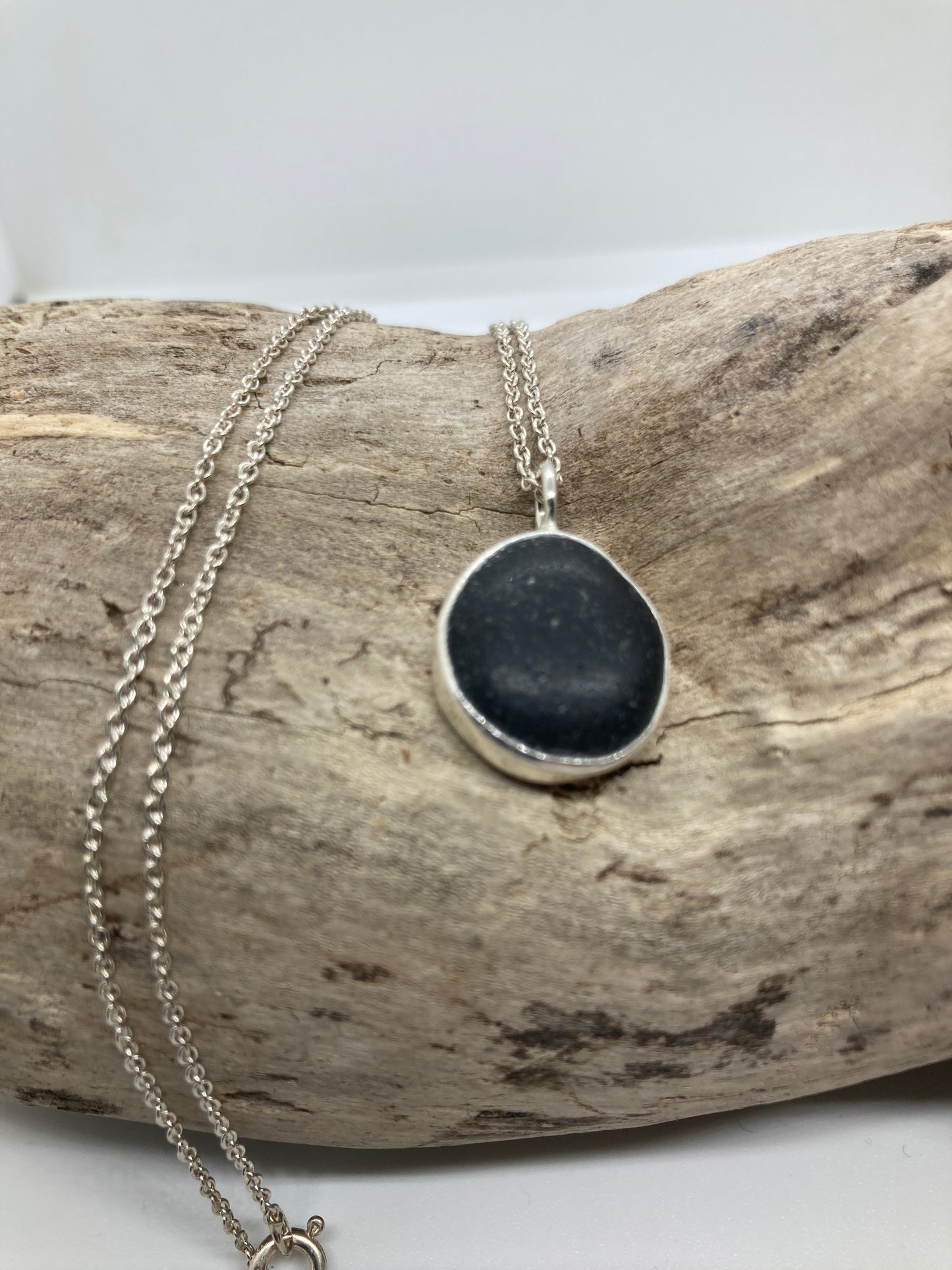 Black Seaham sea glass and sterling silver pendant