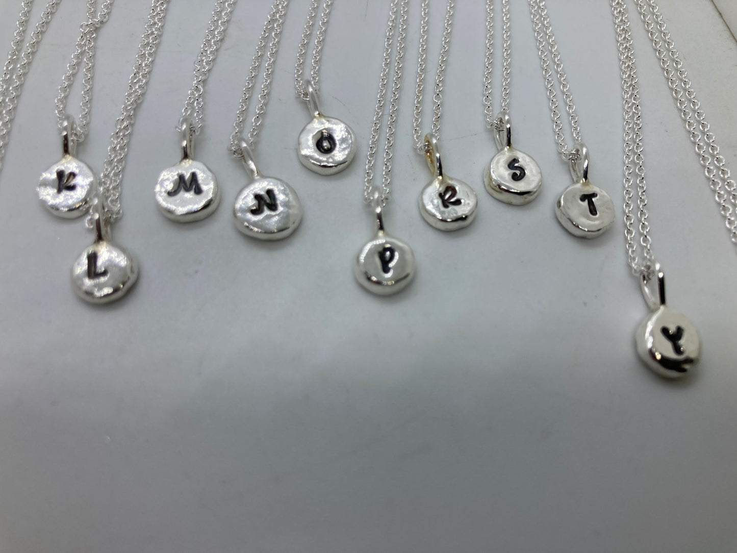 Initial pebble pendants