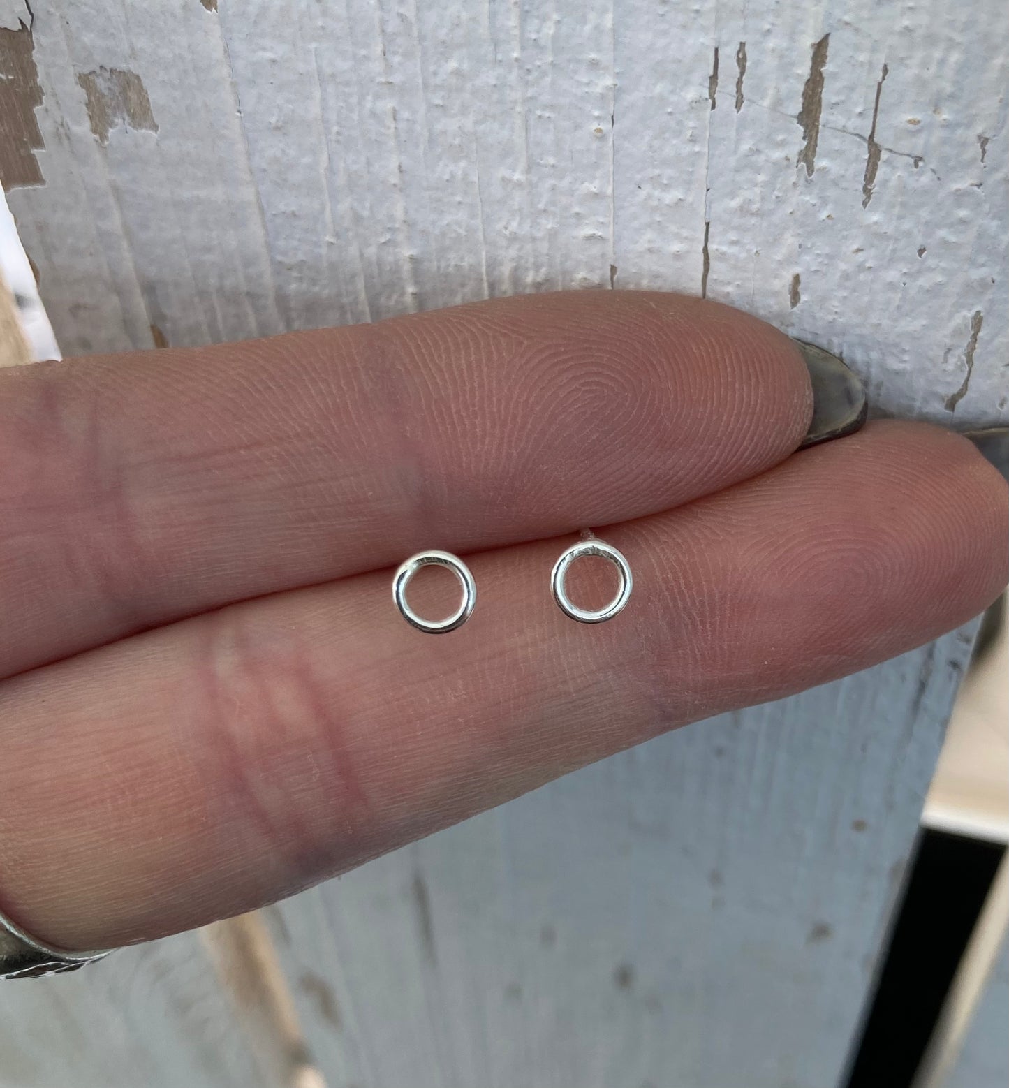 Tiny open circle stud earrings
