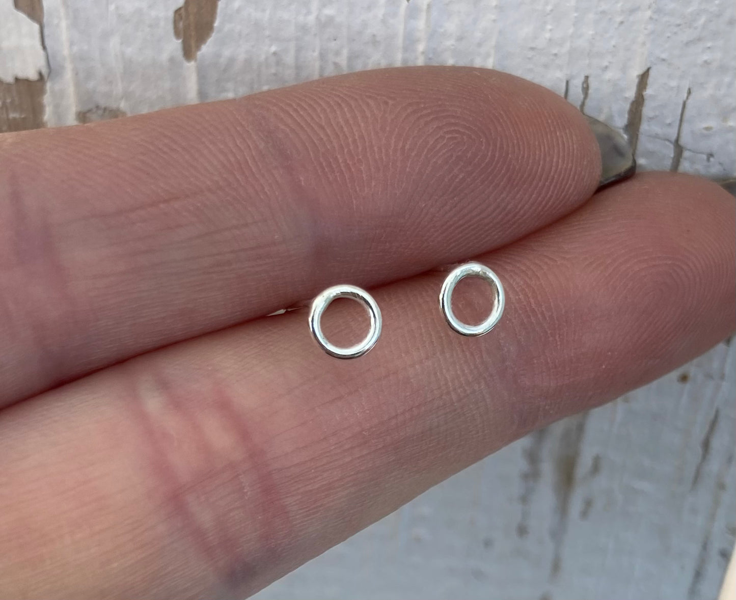 Tiny open circle stud earrings