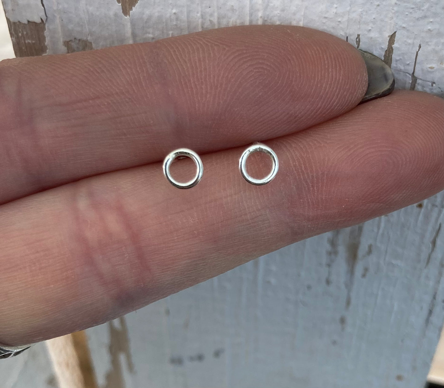 Tiny open circle stud earrings