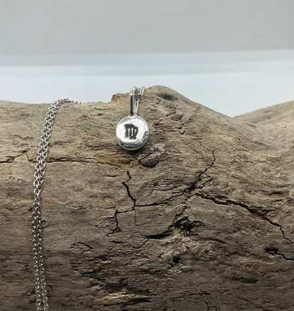 Star sign silver pebble pendants