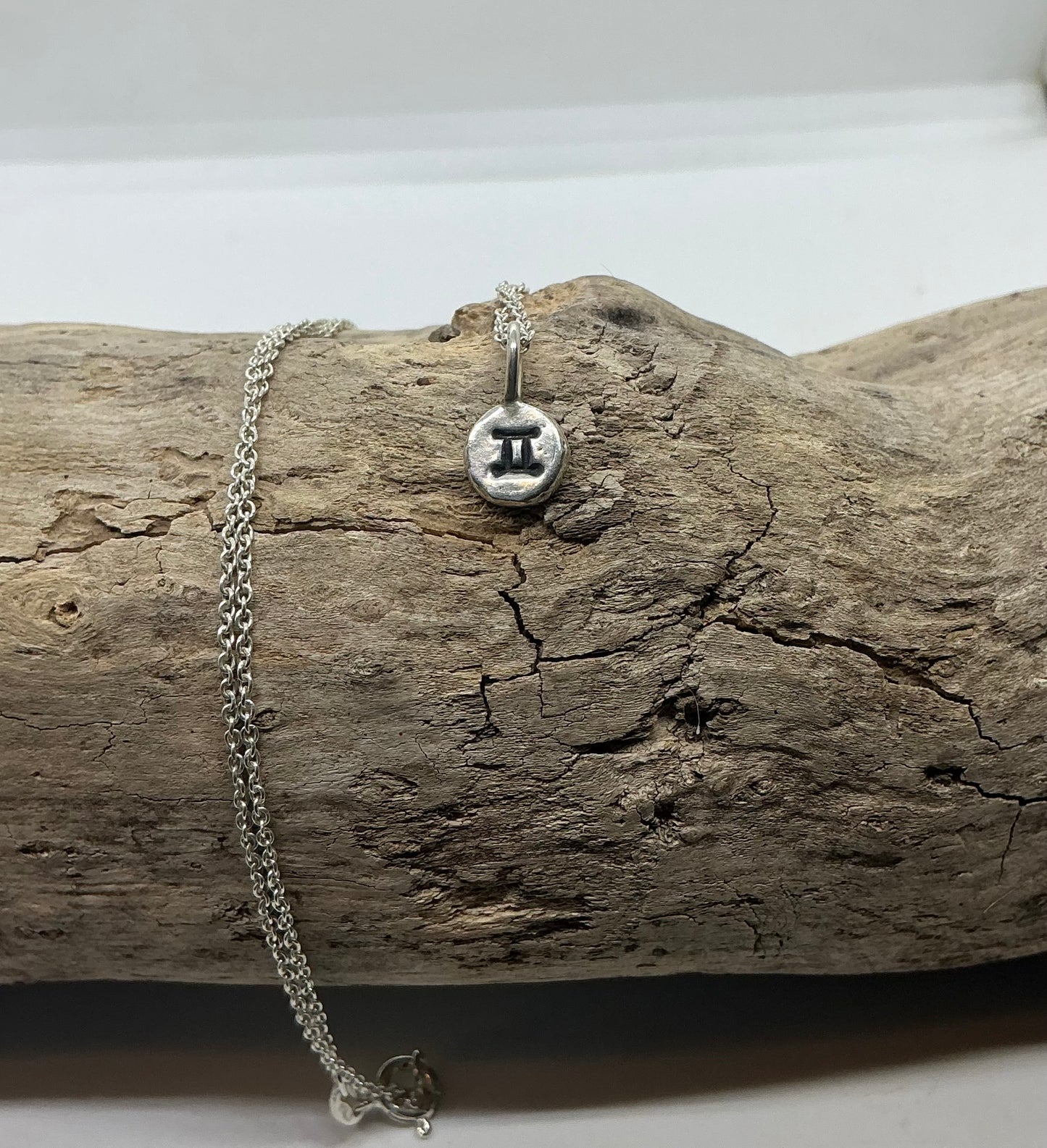 Star sign silver pebble pendants