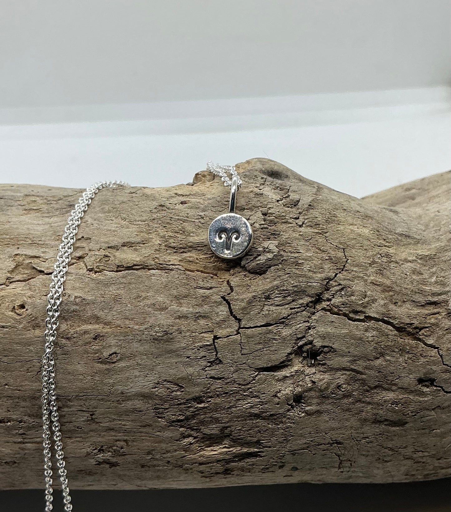 Star sign silver pebble pendants