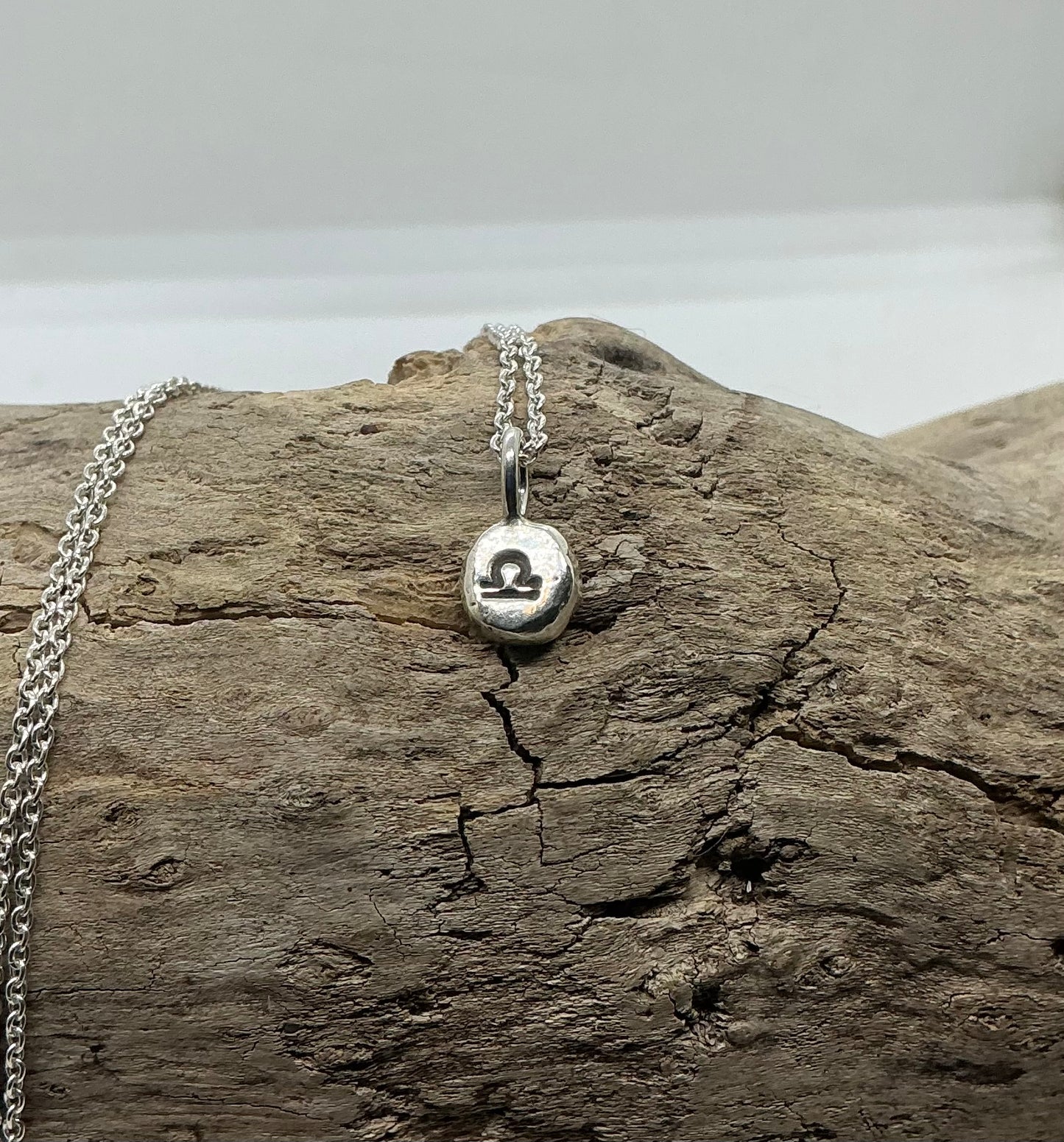 Star sign silver pebble pendants