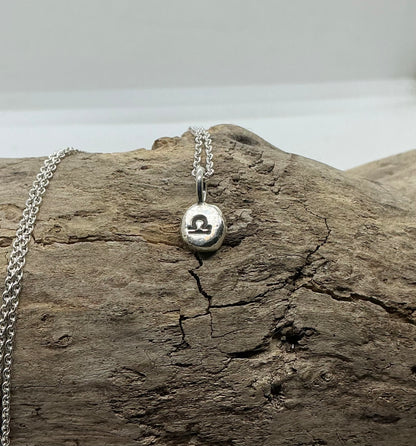 Star sign silver pebble pendants