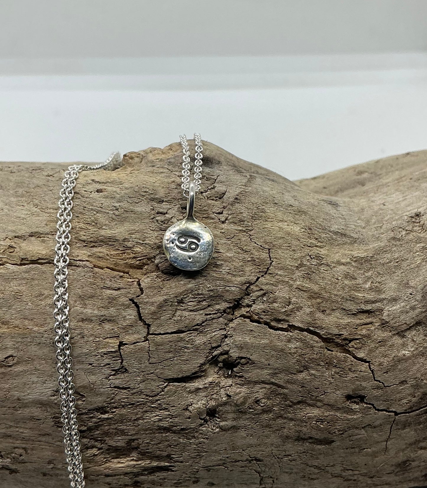 Star sign silver pebble pendants