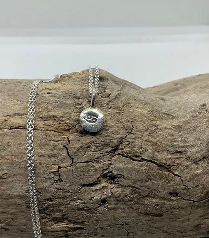 Star sign silver pebble pendants