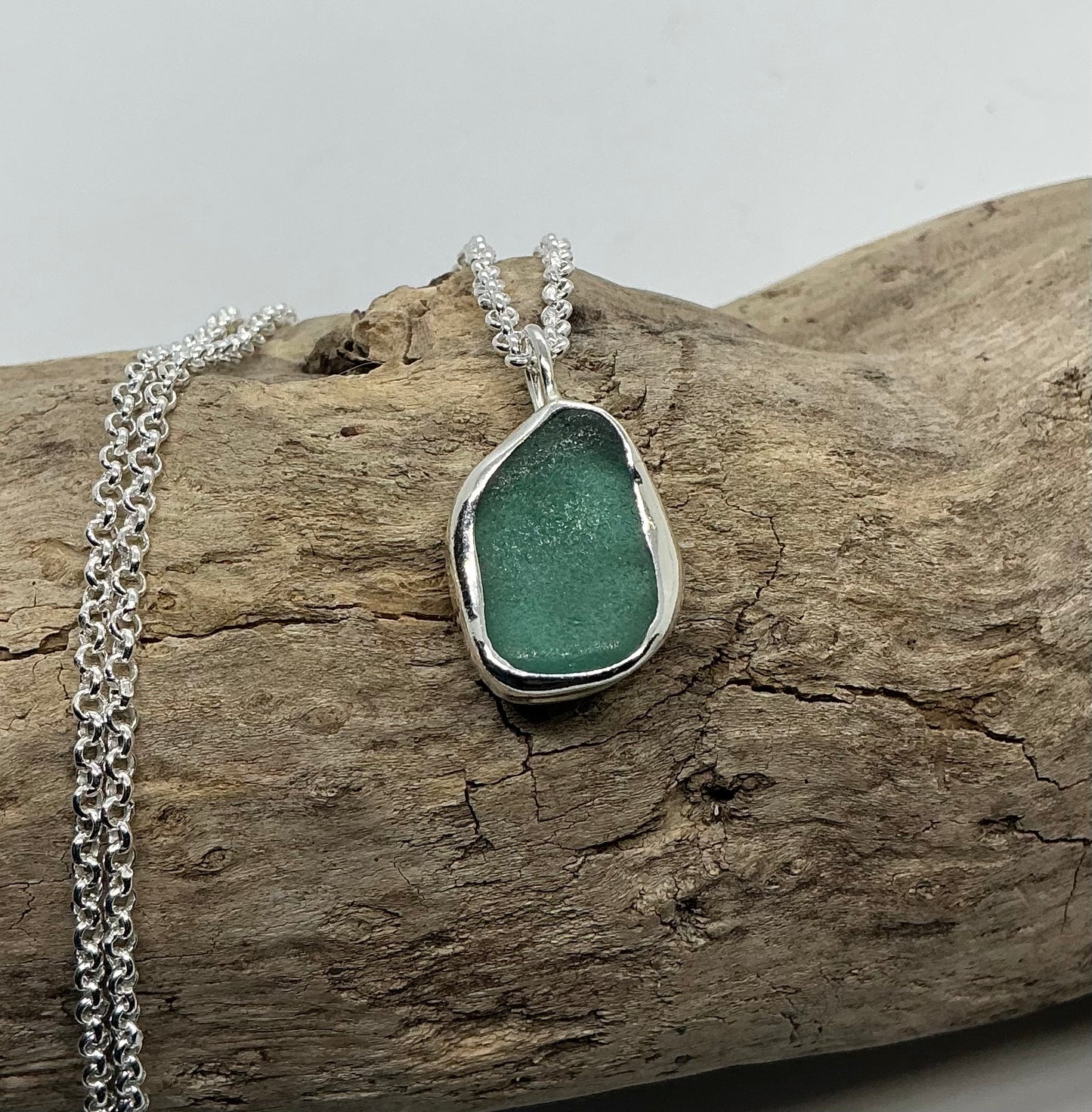 Frosted sage green indented sea glass pendant