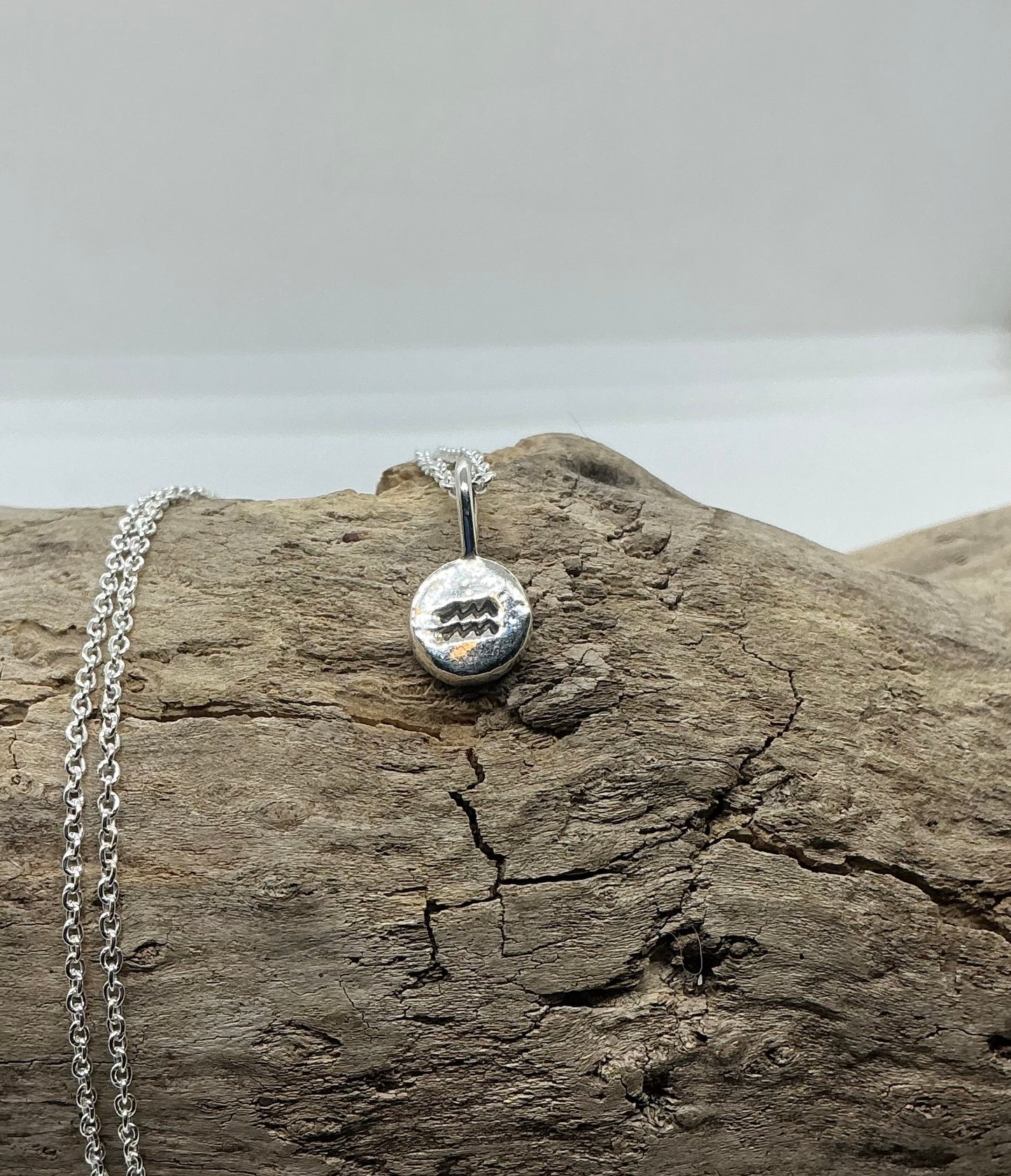 Star sign silver pebble pendants