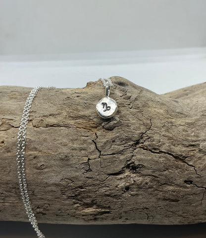 Star sign silver pebble pendants