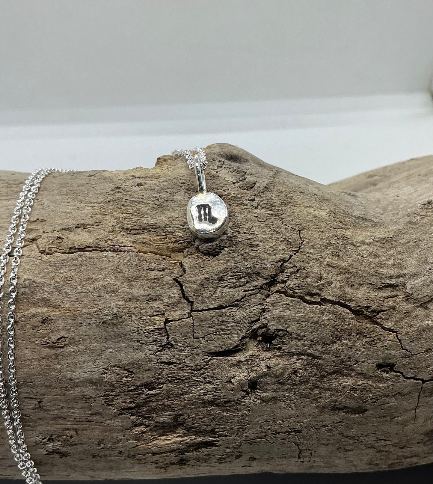 Star sign silver pebble pendants