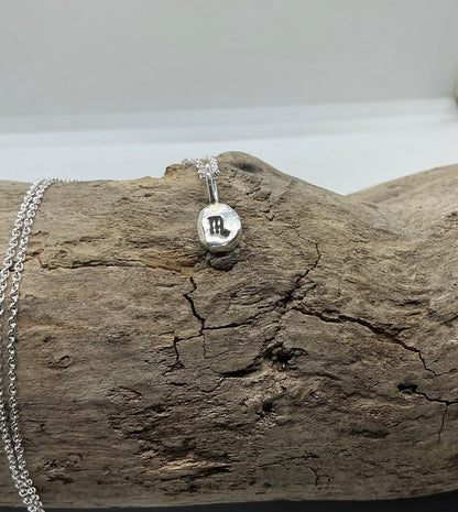 Star sign silver pebble pendants