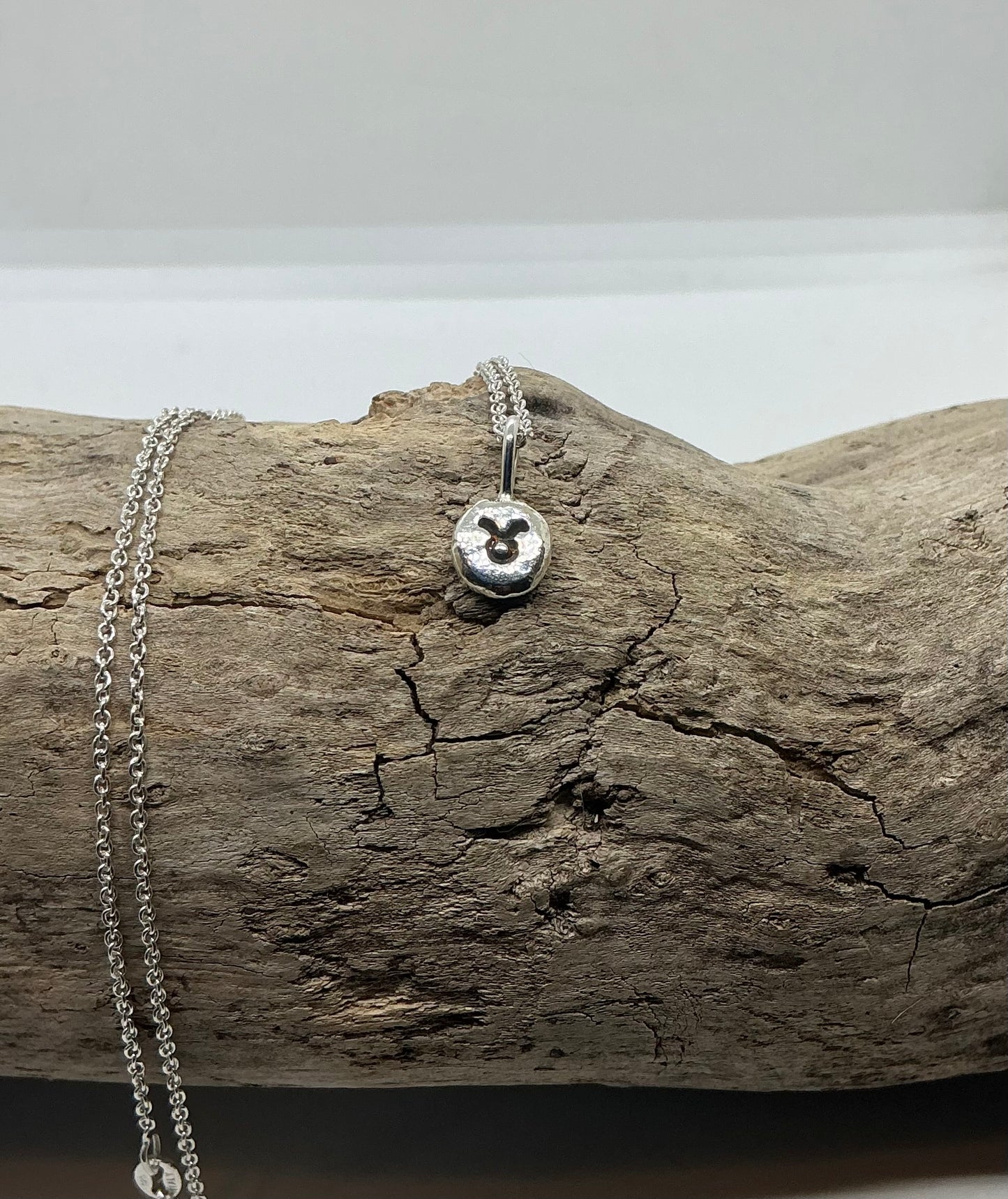 Star sign silver pebble pendants